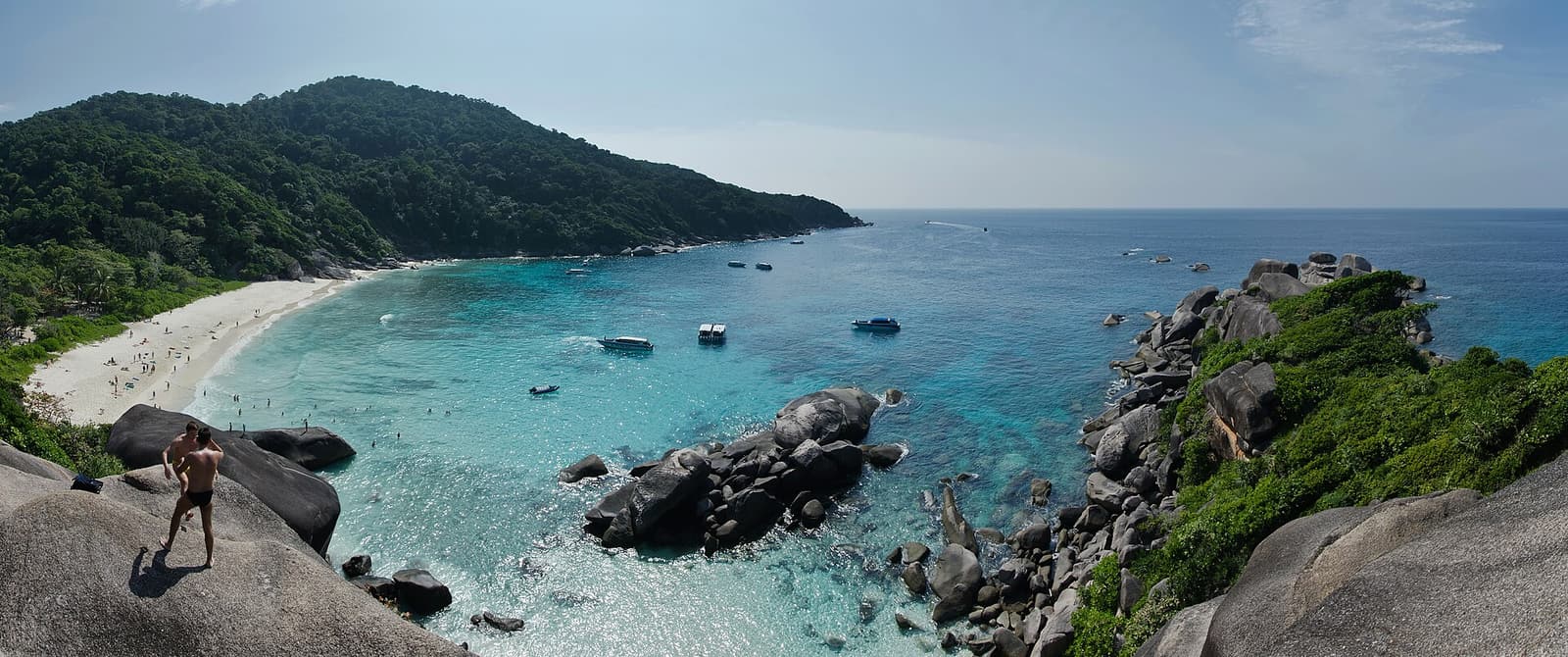 A turquoise bay ringed by granite boulders in the Similan Islands
