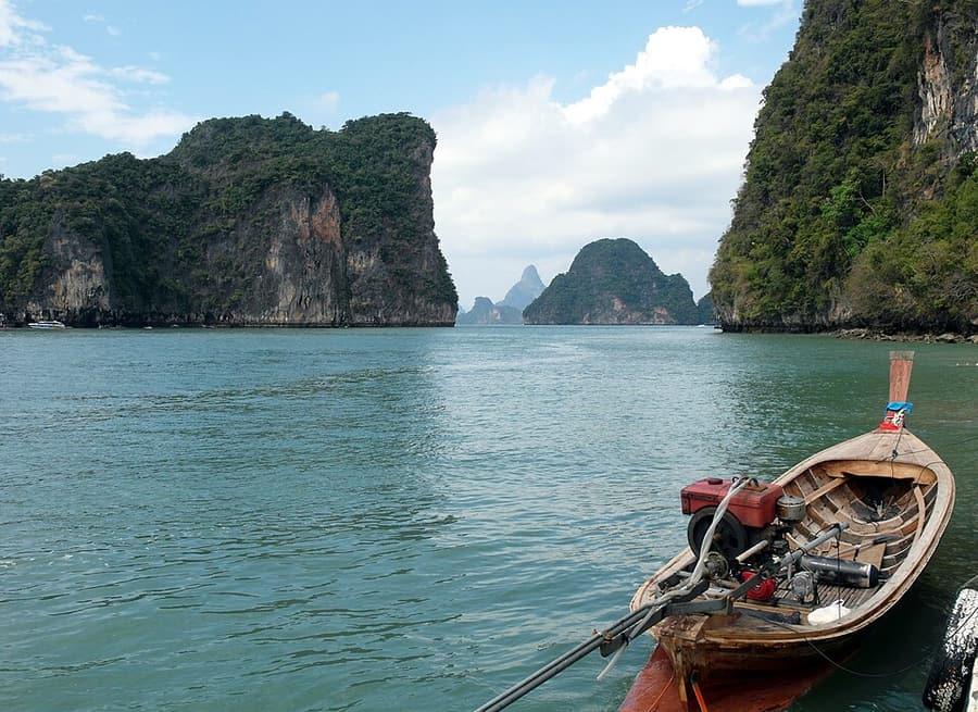 A longtail boat among the limestone islands off Koh Hong, Krabi