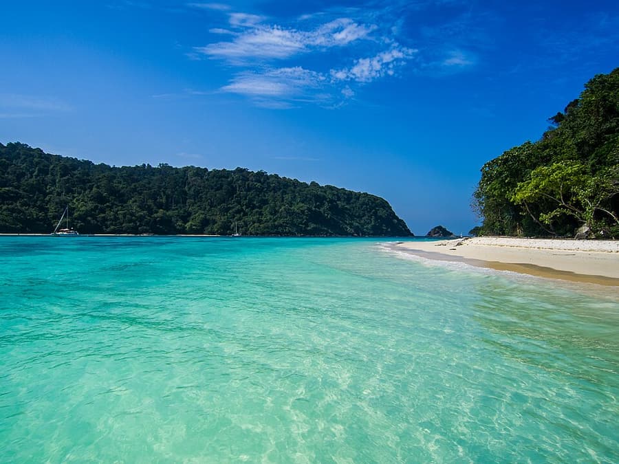 An empty white beach and clear water on Koh Rok Yai
